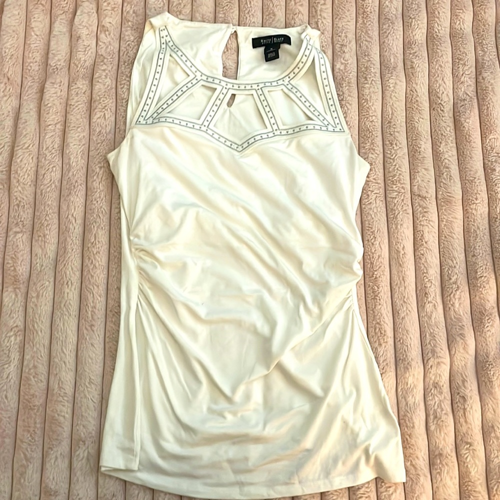 Women White sleeveless Top. Silver/white stitching